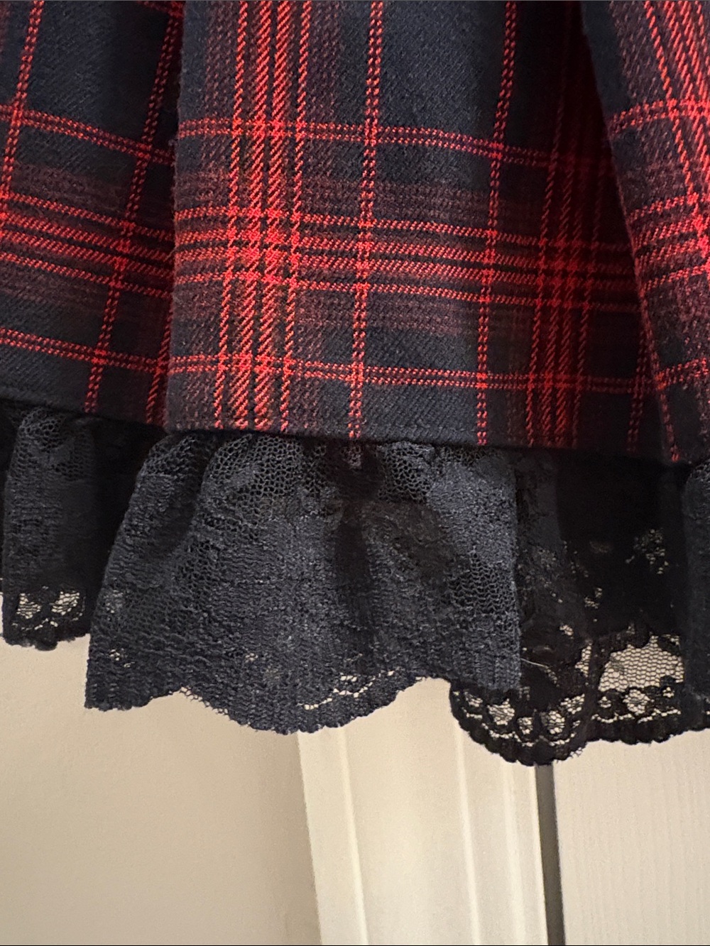Dolls Kill Red and Black Plaid Pleated Mini Skirt with Lace Hem - Picture 2 of 6